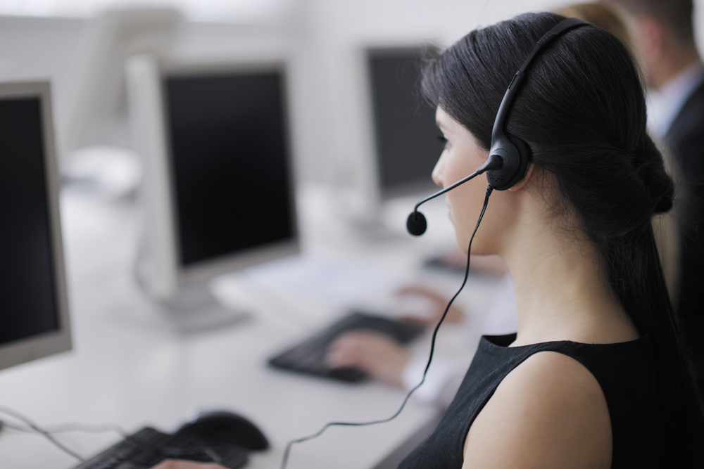 business people group with  headphones giving support in  help desk office to customers, manager giving training and education instructions